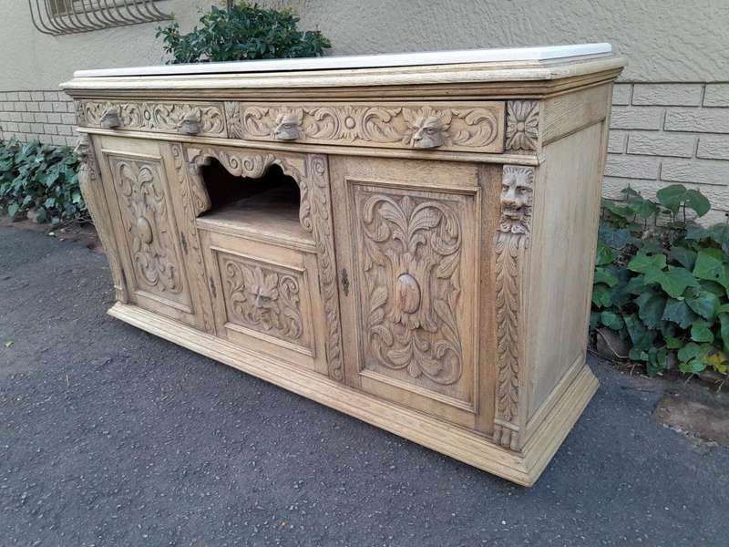 An Early 20th Century Heavily Carved Oak Sideboard / Buffet / Drinks Table With Two Drawers And T...