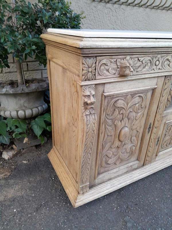 An Early 20th Century Heavily Carved Oak Sideboard / Buffet / Drinks Table With Two Drawers And T...