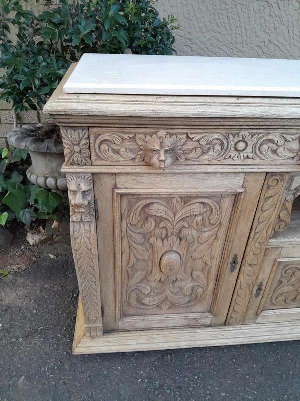 An Early 20th Century Heavily Carved Oak Sideboard / Buffet / Drinks Table With Two Drawers And T...