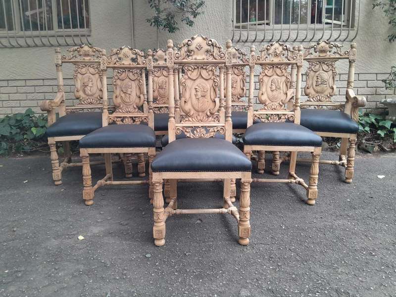 A 19th Century Circa 1880  Renaissance Revival Ornately Carved Oak Set of Dining Chairs Comprisi...