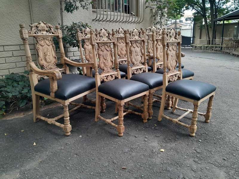 A 19th Century Circa 1880  Renaissance Revival Ornately Carved Oak Set of Dining Chairs Comprisi...