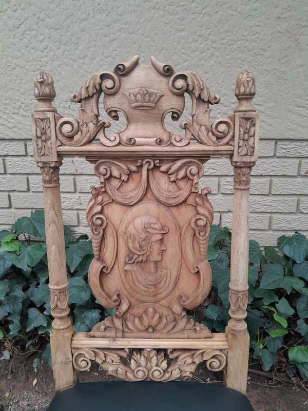 A 19th Century Circa 1880  Renaissance Revival Ornately Carved Oak Set of Dining Chairs Comprisi...