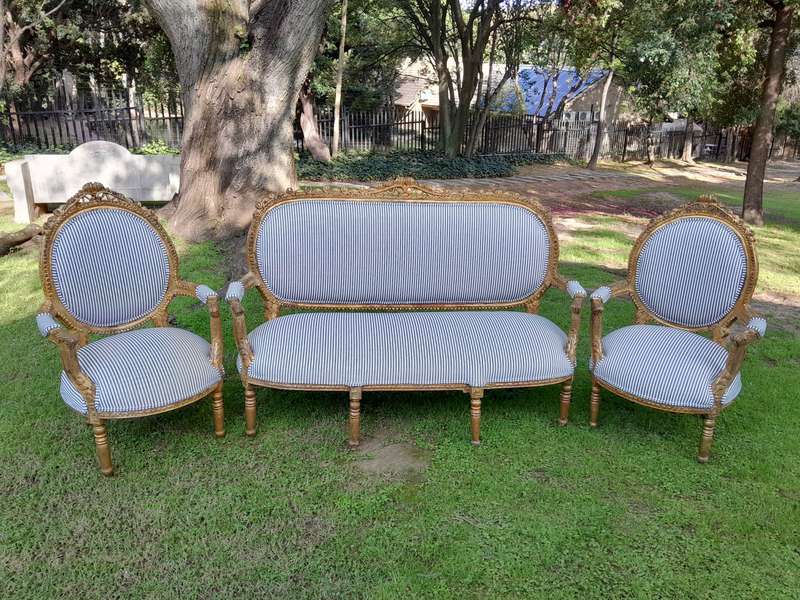 A 20th Century French Style Ornately Carved and Gilded Set Of Settee And a Pair Of Armchairs Upho...
