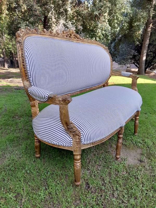 A 20th Century French Style Ornately Carved and Gilded Set Of Settee And a Pair Of Armchairs Upho...