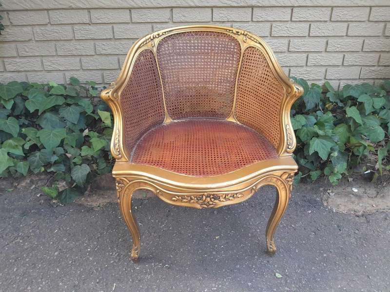A 20TH Century French Style Gilded Rattan Bergère Chair