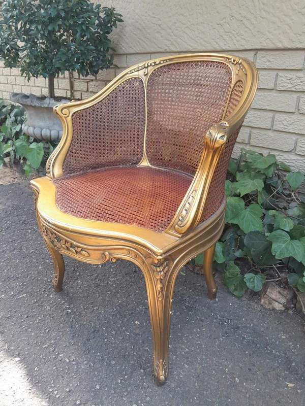 A 20TH Century French Style Gilded Rattan Bergère Chair