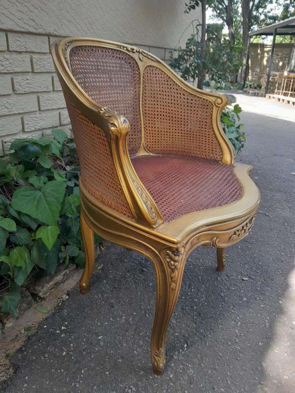 A 20TH Century French Style Gilded Rattan Bergère Chair