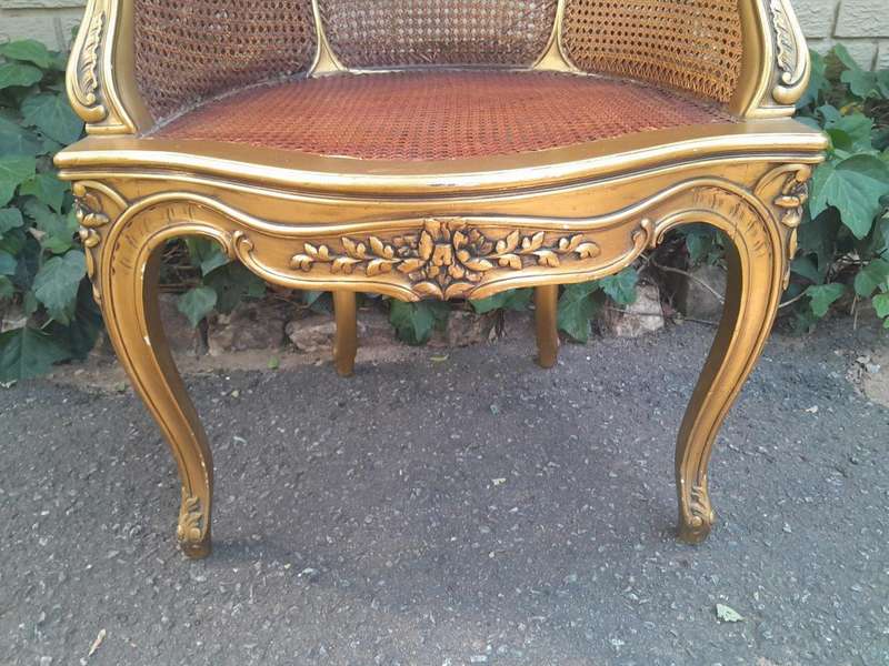 A 20TH Century French Style Gilded Rattan Bergère Chair