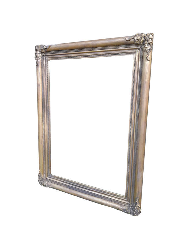 A 20th Century French Style Ornately Carved And Hand Gilded Bevelled Mirror