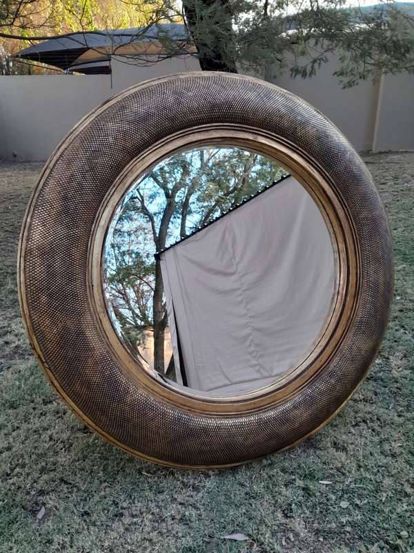 A Hang Gilded in Gold Leaf Bevelled Circular Mirror