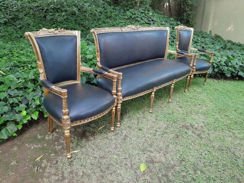 A 20th Century Set Of French Style Carved And Gilded Settee And Pair Of Armchairs Upholstered In ...