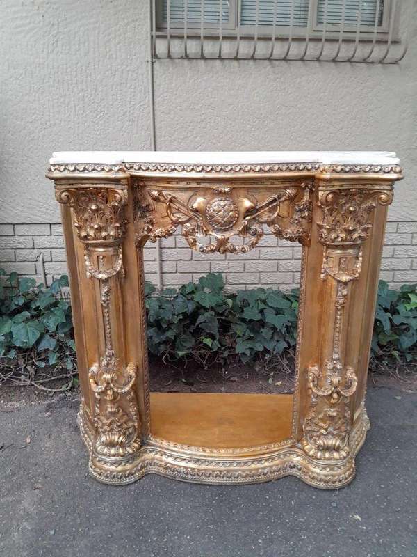 A 20TH Century French Style Ornately Hand Carved and Gilded Fireplace Surround