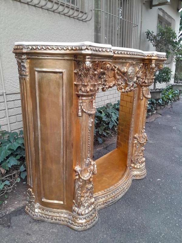 A 20TH Century French Style Ornately Hand Carved and Gilded Fireplace Surround