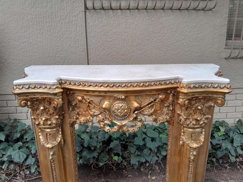 A 20TH Century French Style Ornately Hand Carved and Gilded Fireplace Surround