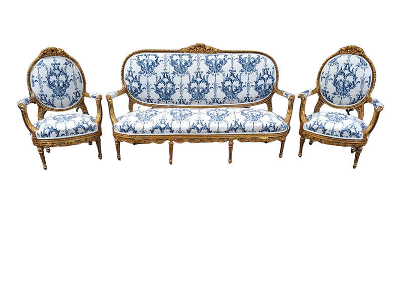 A 20TH Century French Louis XVI Style Set Of A Carved And Gilded Settee And Pair Of Armchairs