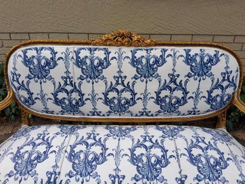 A 20TH Century French Louis XVI Style Set Of A Carved And Gilded Settee And Pair Of Armchairs