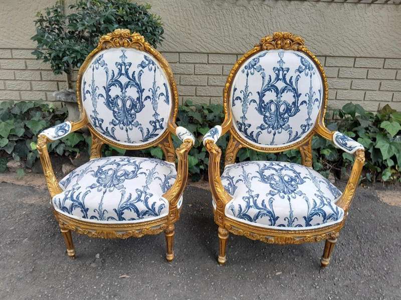 A 20TH Century French Louis XVI Style Set Of A Carved And Gilded Settee And Pair Of Armchairs