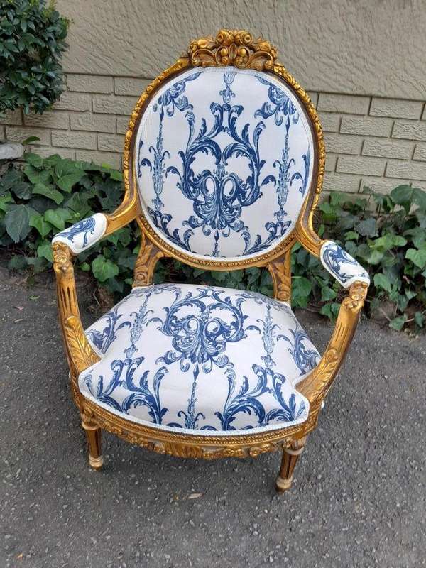 A 20TH Century French Louis XVI Style Set Of A Carved And Gilded Settee And Pair Of Armchairs