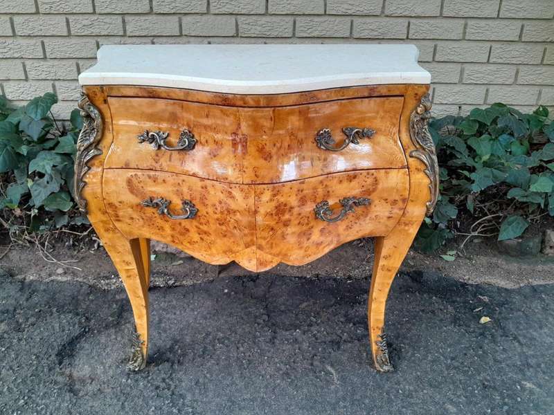 A 20th Century French Style Birds Eye Maple Bombe Chest of Drawers with Marble Top & Ormolu Mounts