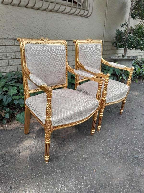 A Pair Of French Style Carved Wooden Gilded Armchairs
