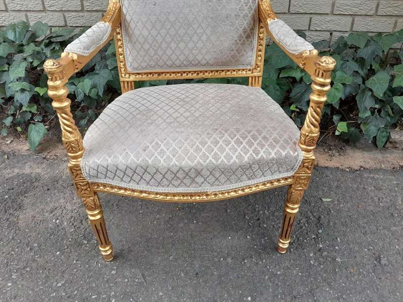 A Pair Of French Style Carved Wooden Gilded Armchairs