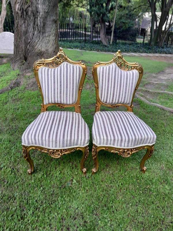 A Pair of French Rococo Style Carved Wooden Gilded Armchairs