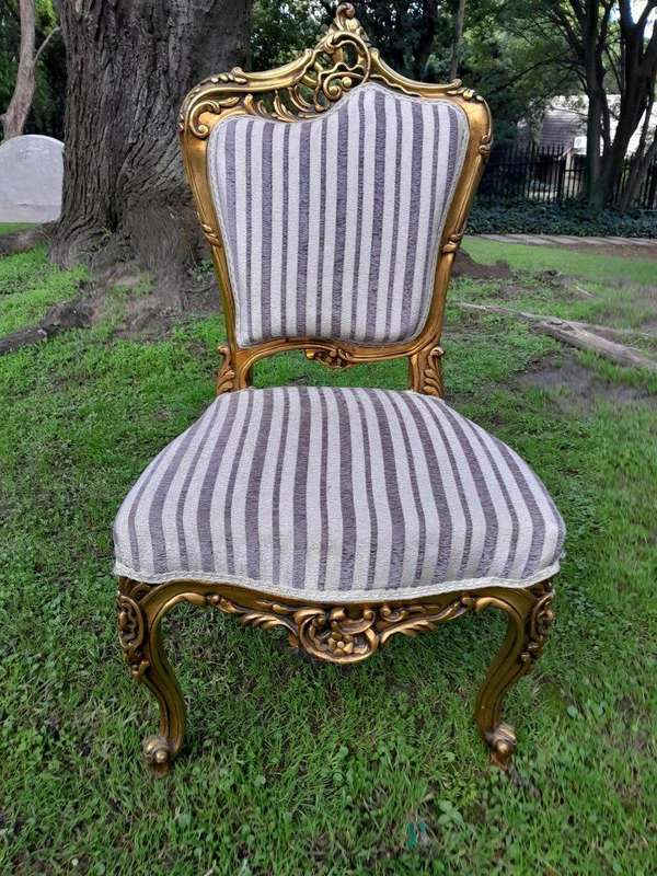 A Pair of French Rococo Style Carved Wooden Gilded Armchairs