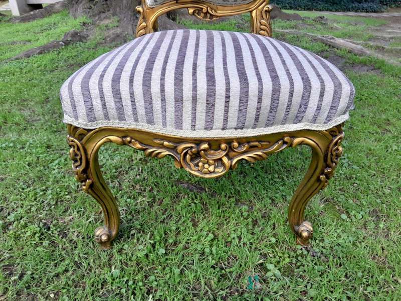 A Pair of French Rococo Style Carved Wooden Gilded Armchairs