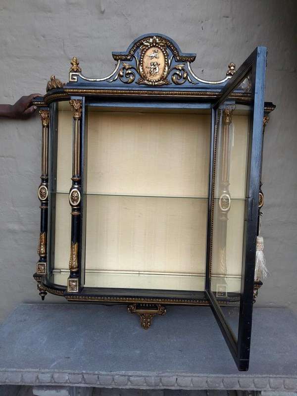 A Massive French 19th Century Carved and Gilded Wall Display Cabinet