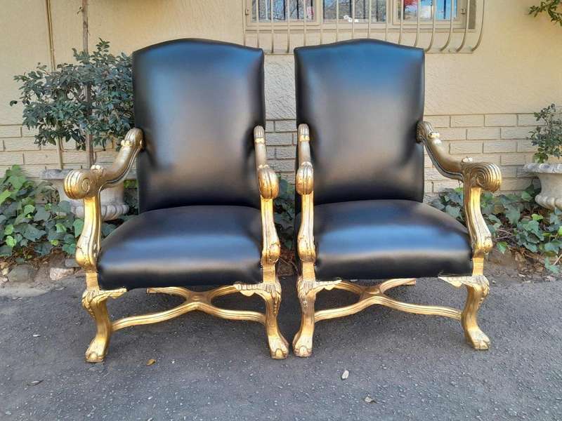 A Pair Of French Louis XIV Style Hand Gilded Armchairs Upholstered In Leather