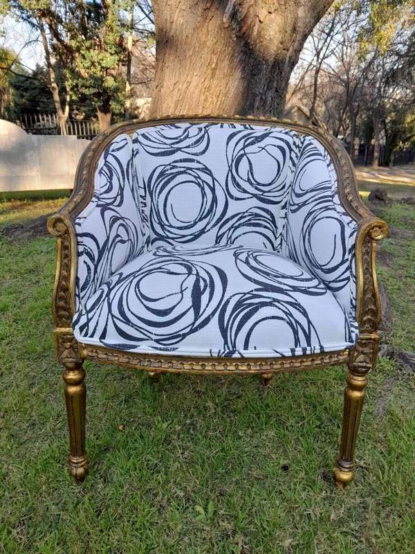A 20th Century French Louis Bergere Style Set Of Three Carved and Gilded Chairs in a Custom Made ...