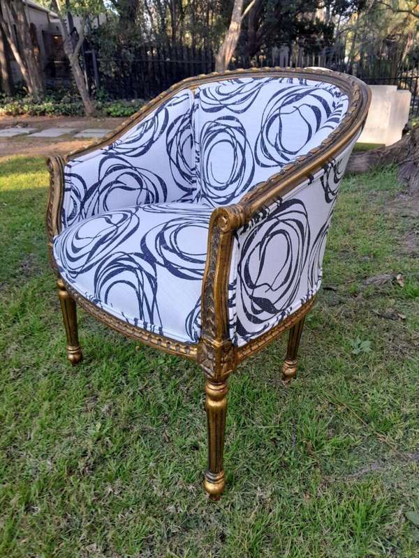 A 20th Century French Louis Bergere Style Set Of Three Carved and Gilded Chairs in a Custom Made ...