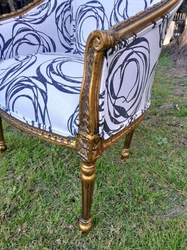 A 20th Century French Louis Bergere Style Set Of Three Carved and Gilded Chairs in a Custom Made ...