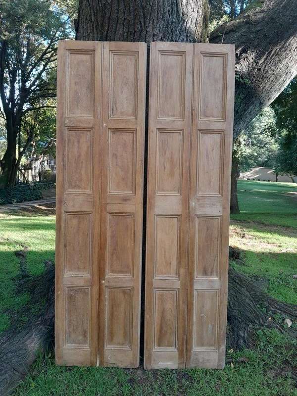 A 20th Century Pair of French Wooden Shutters with Bevelled Panels in a Contemporary Bleached Fin...