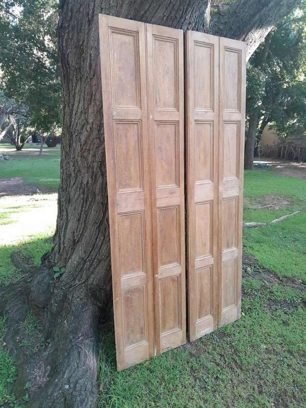 A 20th Century Pair of French Wooden Shutters with Bevelled Panels in a Contemporary Bleached Fin...