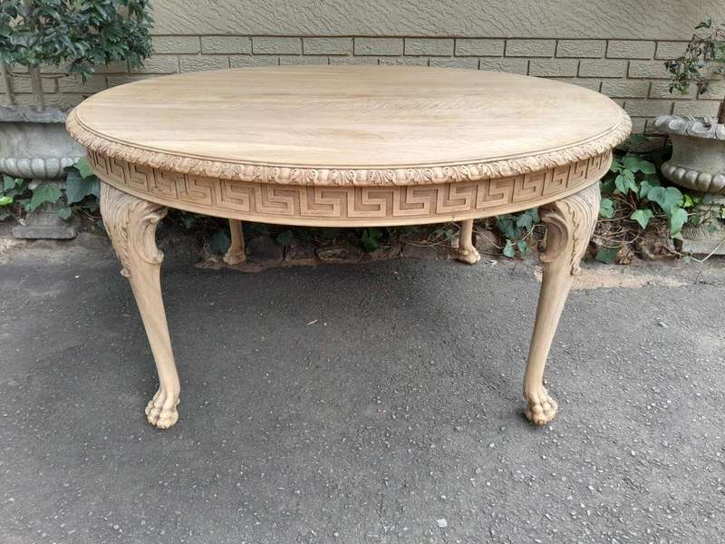 A 20th Century Heavily Carved Round Table in  a Contemporary Bleached Finish with Bevelled Mirro...