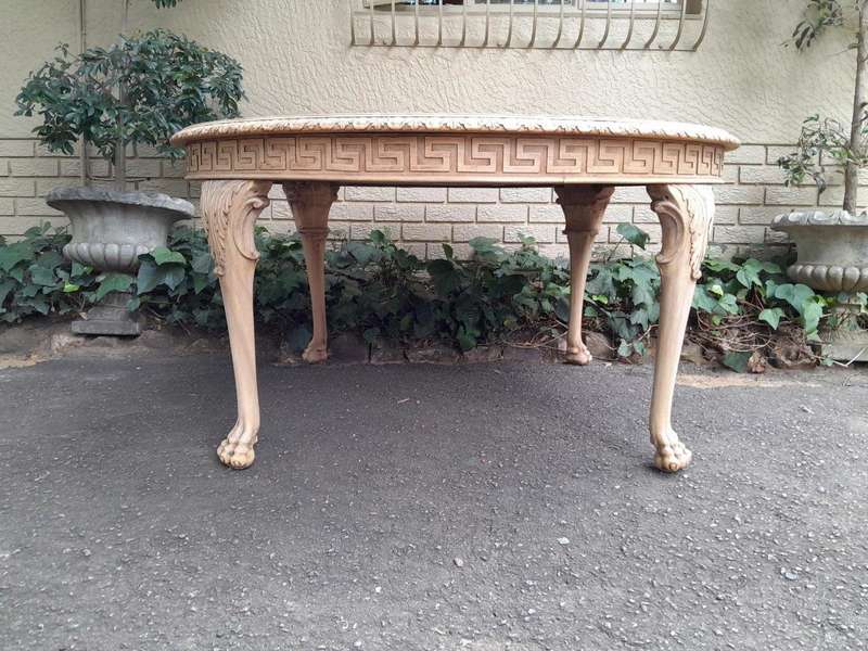 A 20th Century Heavily Carved Round Table in  a Contemporary Bleached Finish with Bevelled Mirro...