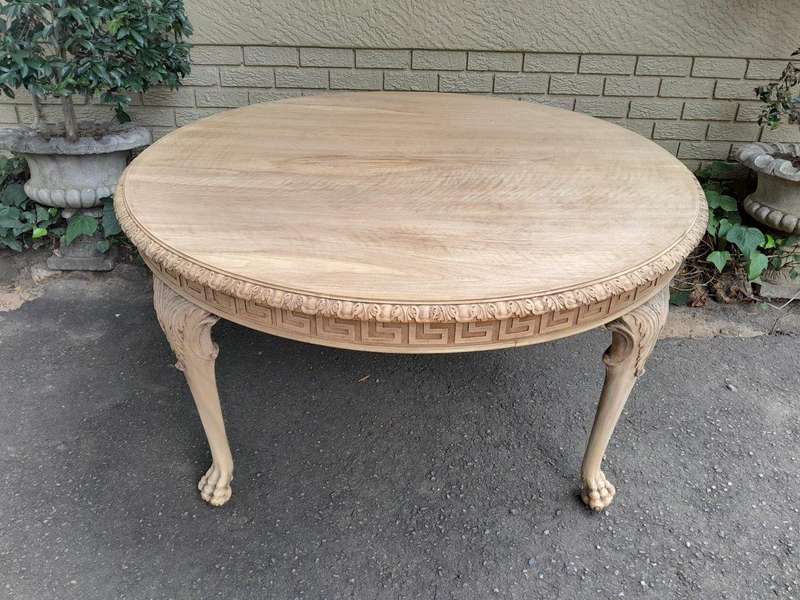 A 20th Century Heavily Carved Round Table in  a Contemporary Bleached Finish with Bevelled Mirro...