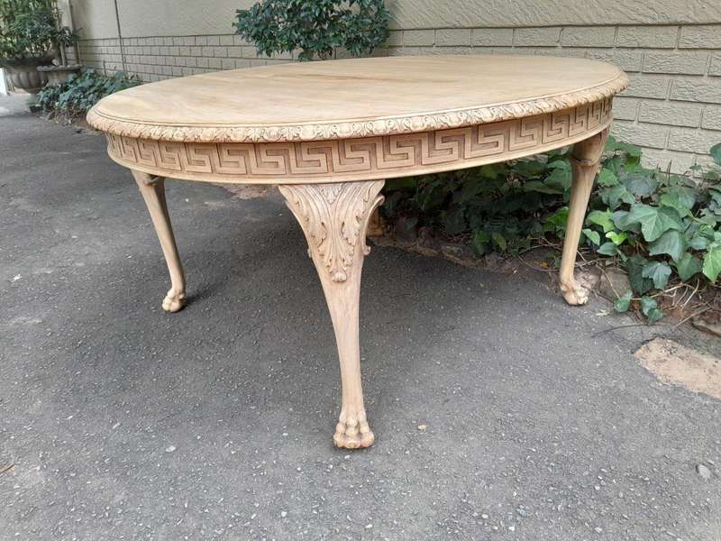 A 20th Century Heavily Carved Round Table in  a Contemporary Bleached Finish with Bevelled Mirro...