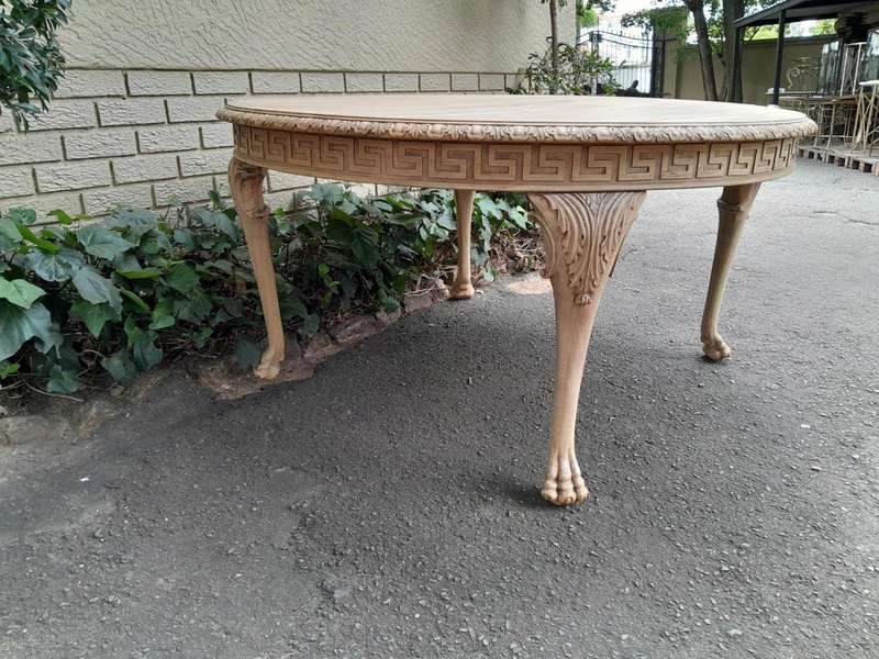 A 20th Century Heavily Carved Round Table in  a Contemporary Bleached Finish with Bevelled Mirro...