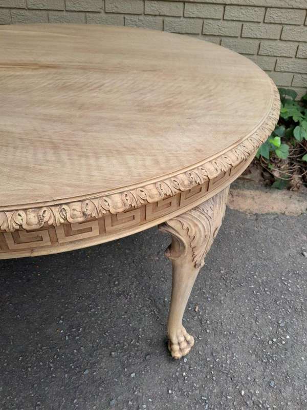 A 20th Century Heavily Carved Round Table in  a Contemporary Bleached Finish with Bevelled Mirro...