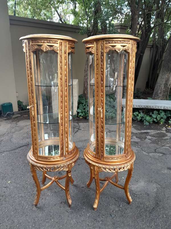 A French Style Pair of Gilded Cylindrical Display Cabinets / Vitrines with Marble Tops