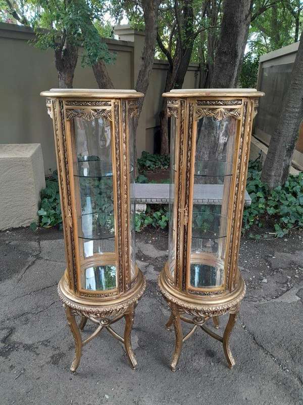 A French Style Pair of Gilded Cylindrical Display Cabinets / Vitrines with Marble Tops