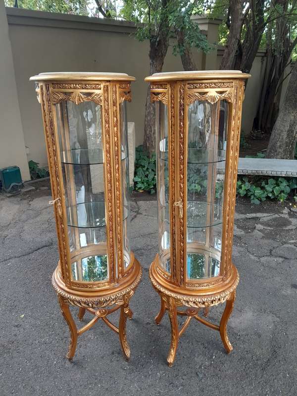 A French Style Pair of Gilded Cylindrical Display Cabinets / Vitrines with Marble Tops