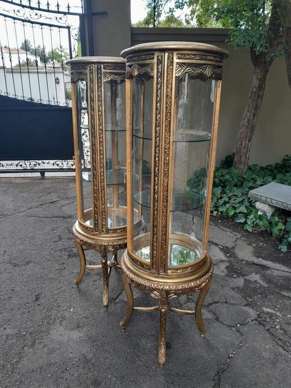 A French Style Pair of Gilded Cylindrical Display Cabinets / Vitrines with Marble Tops