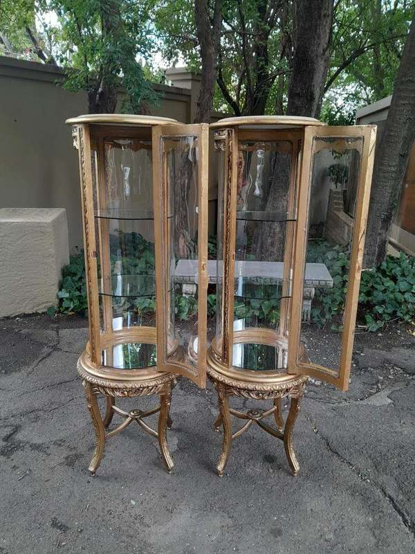 A French Style Pair of Gilded Cylindrical Display Cabinets / Vitrines with Marble Tops
