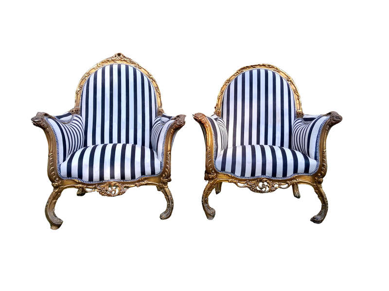 A 20th Century Pair of French Style Louis XVI Style Ornately Carved and Gilded Armchairs