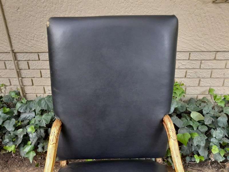 A 20th Century French Style Carved and Giltwood Arm Chairs Upholstered in Leather)