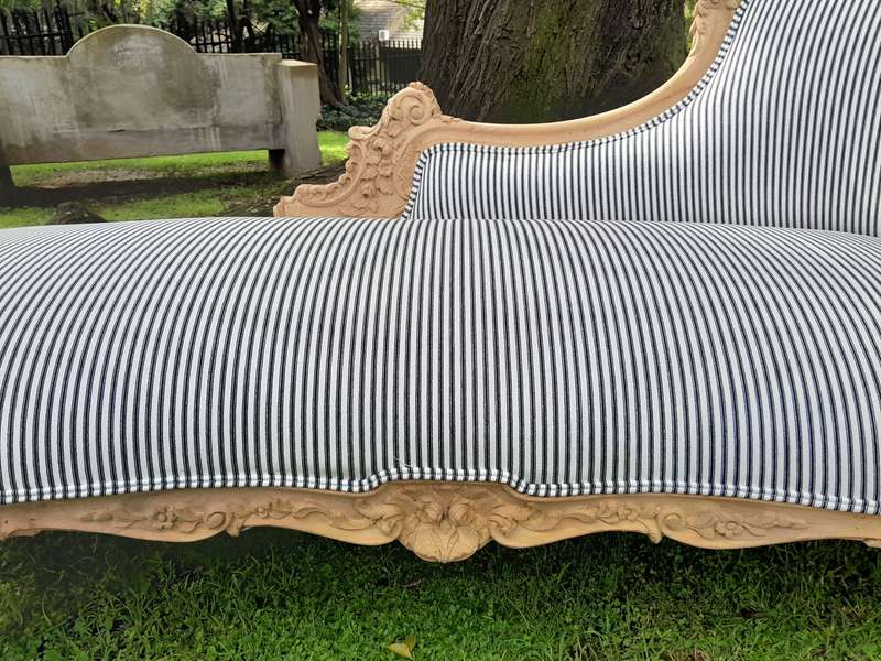 A 20th Century French Style Ornately Carved Chaise Longue in a Contemporary Bleached Finish and U...