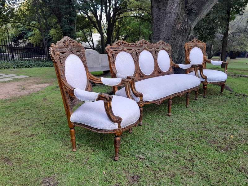 A 20th Century French Louis XVI Style Five Piece Set of Giltwood Settee and Four Armchairs